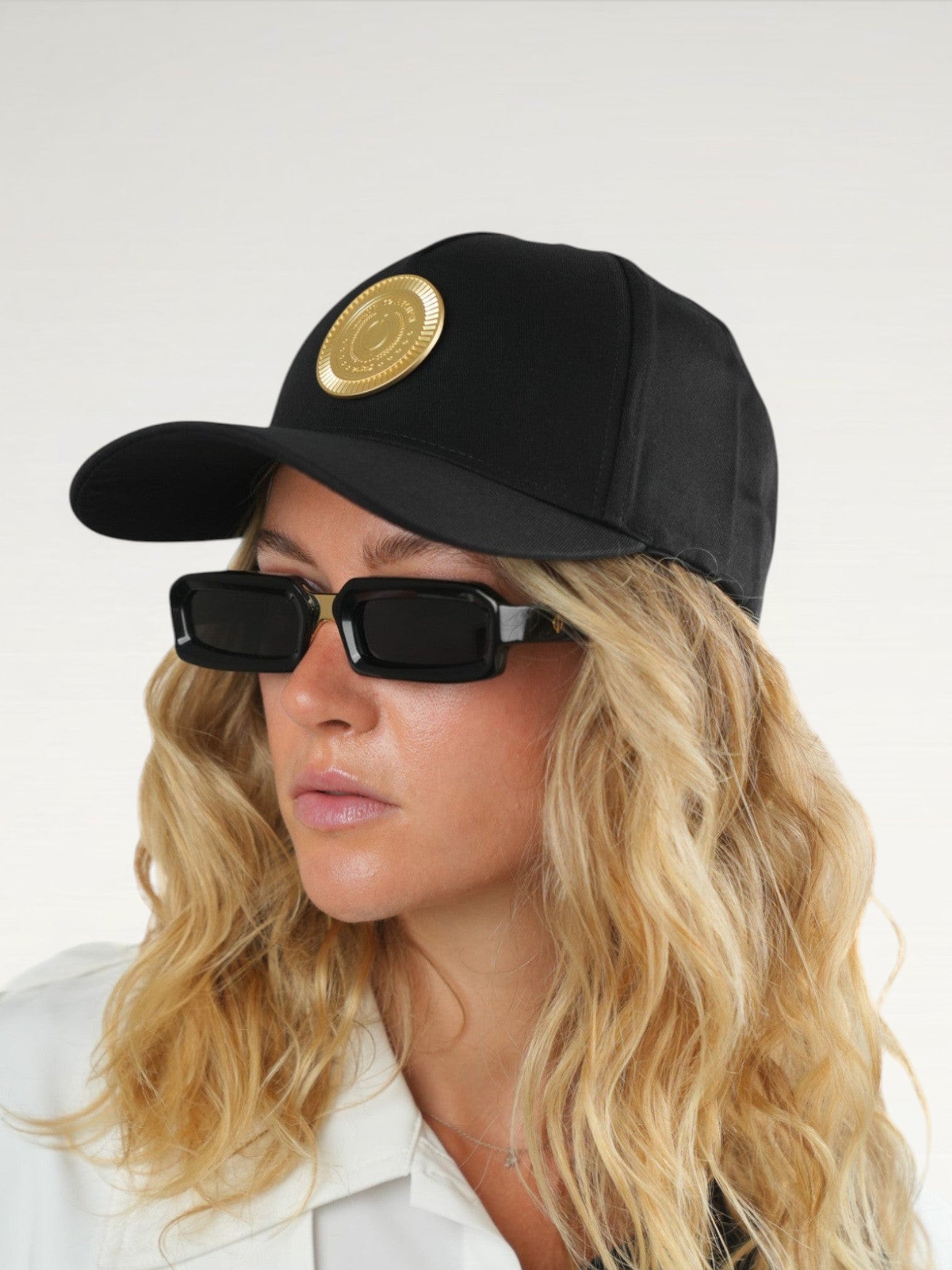 ILIMITO black cotton blend baseball cap with gold medallion emblem and adjustable strap