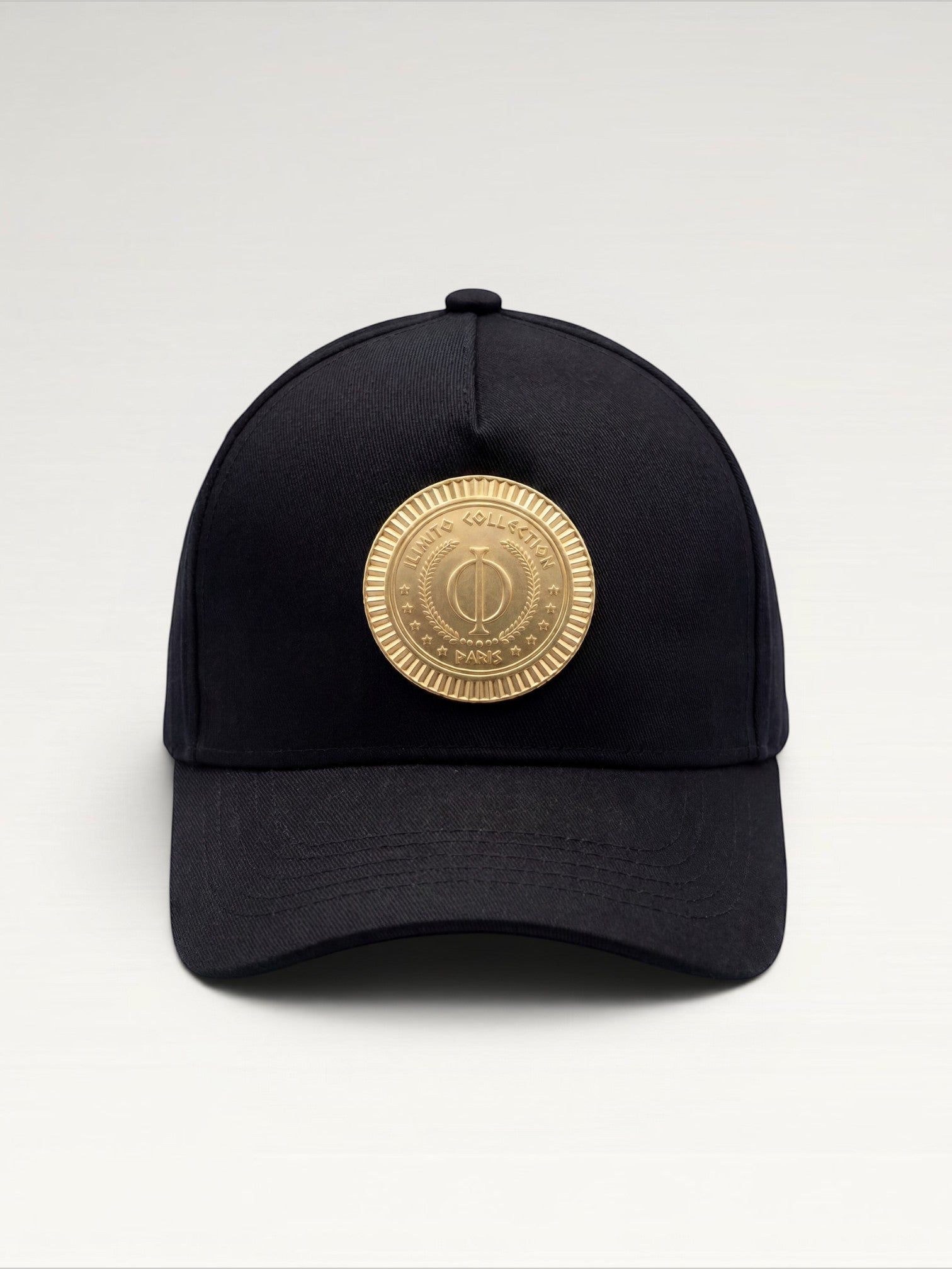 ILIMITO black cotton blend baseball cap with gold medallion emblem and adjustable strap