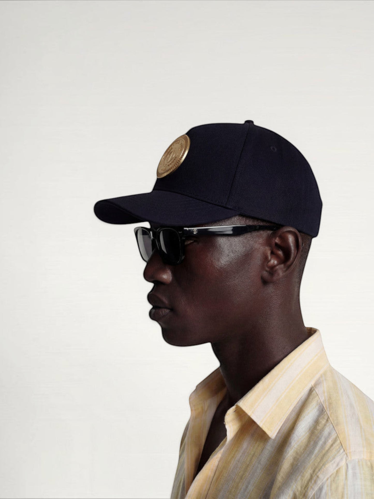 ILIMITO black cotton blend baseball cap with gold medallion emblem and curved brim