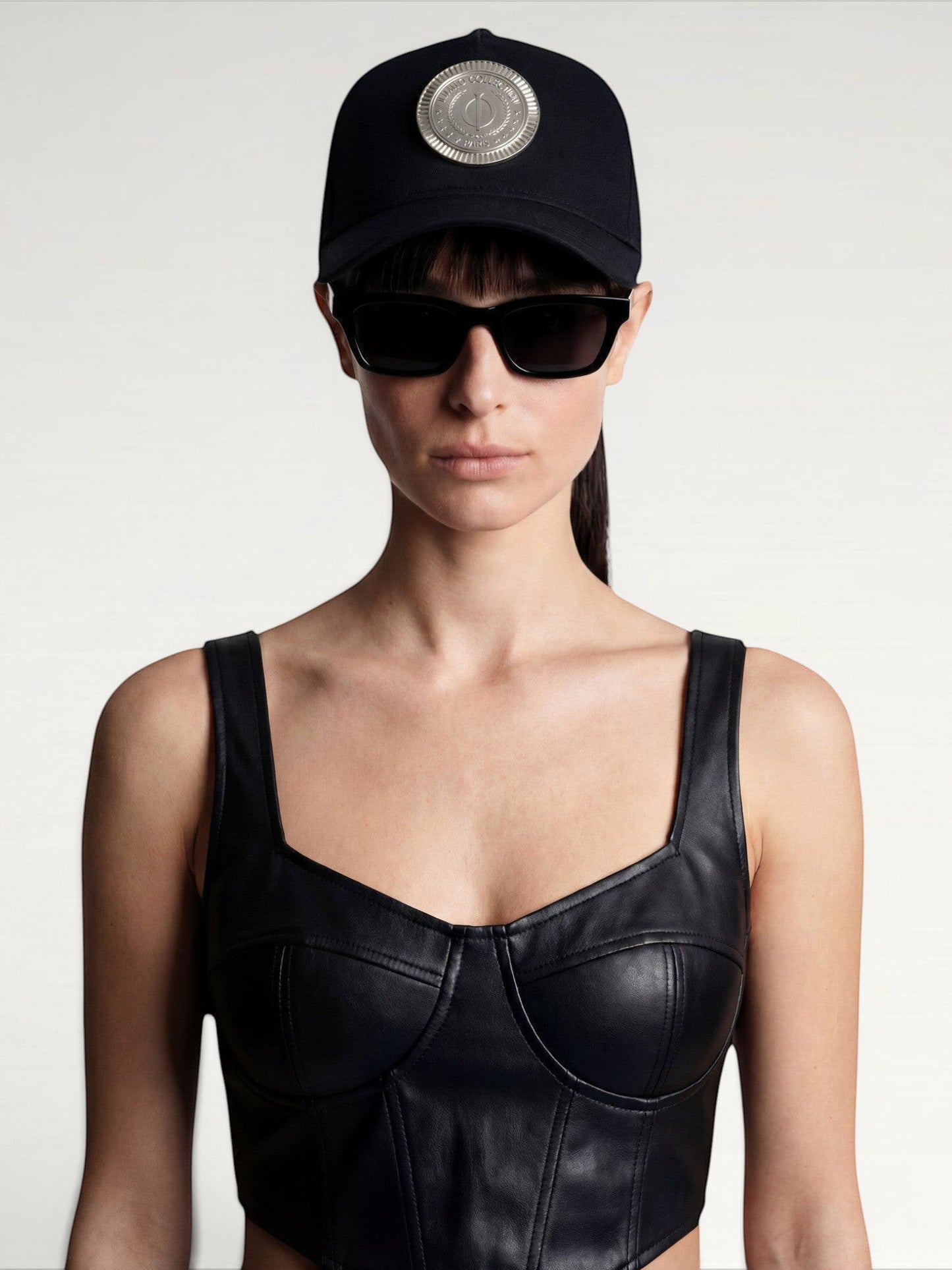 ILIMITO black cotton blend cap with silver medallion detail on the crown