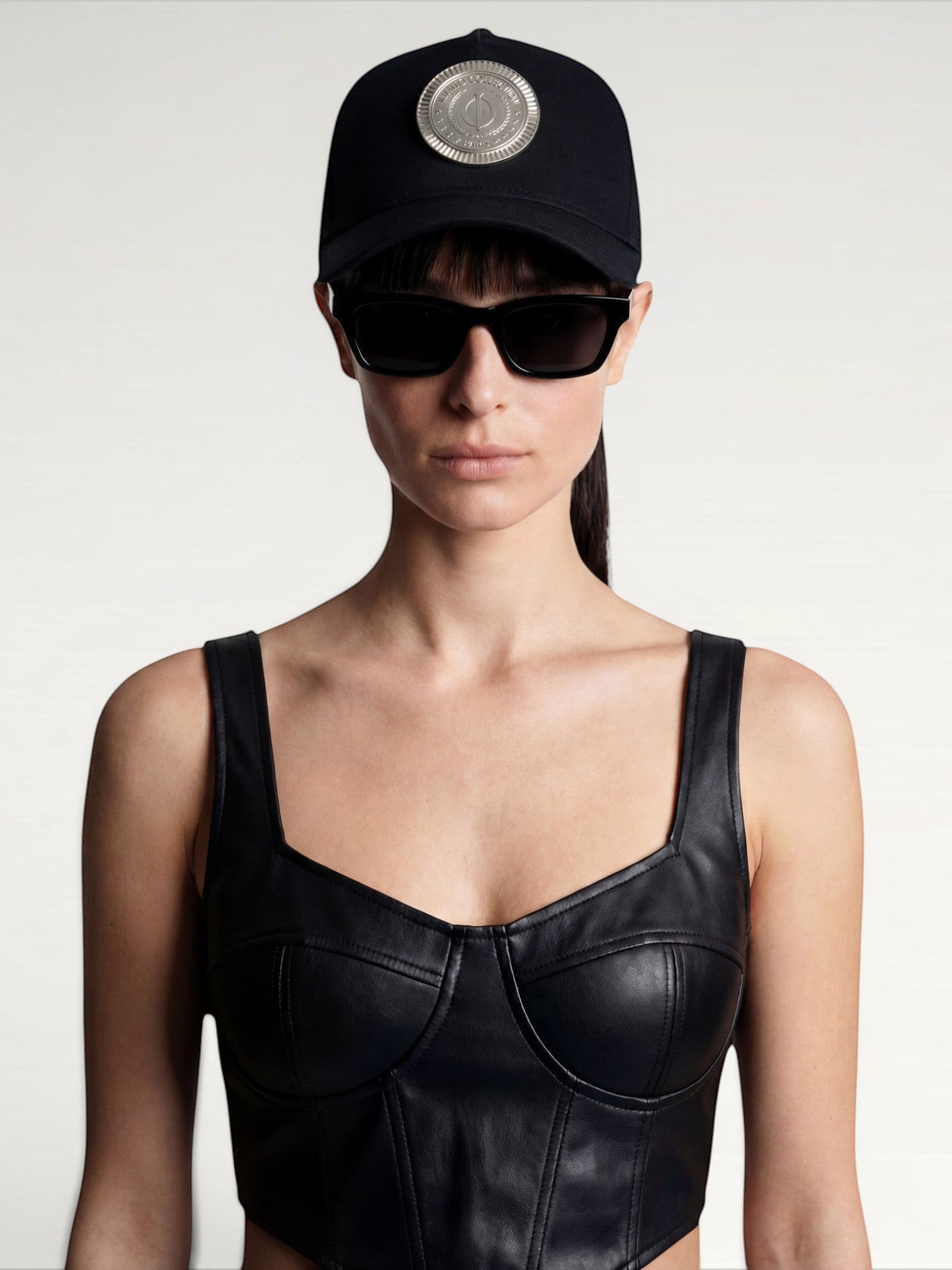 ILIMITO black cotton blend cap with silver medallion detail on the crown