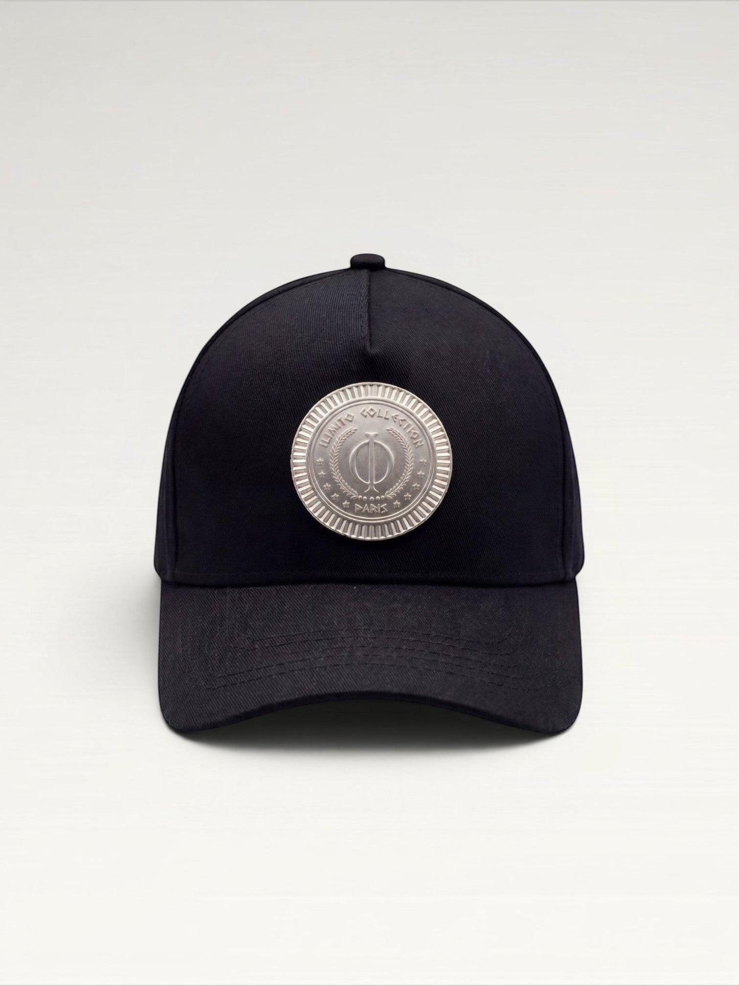 ILIMITO black cotton blend cap with silver medallion detail on the crown