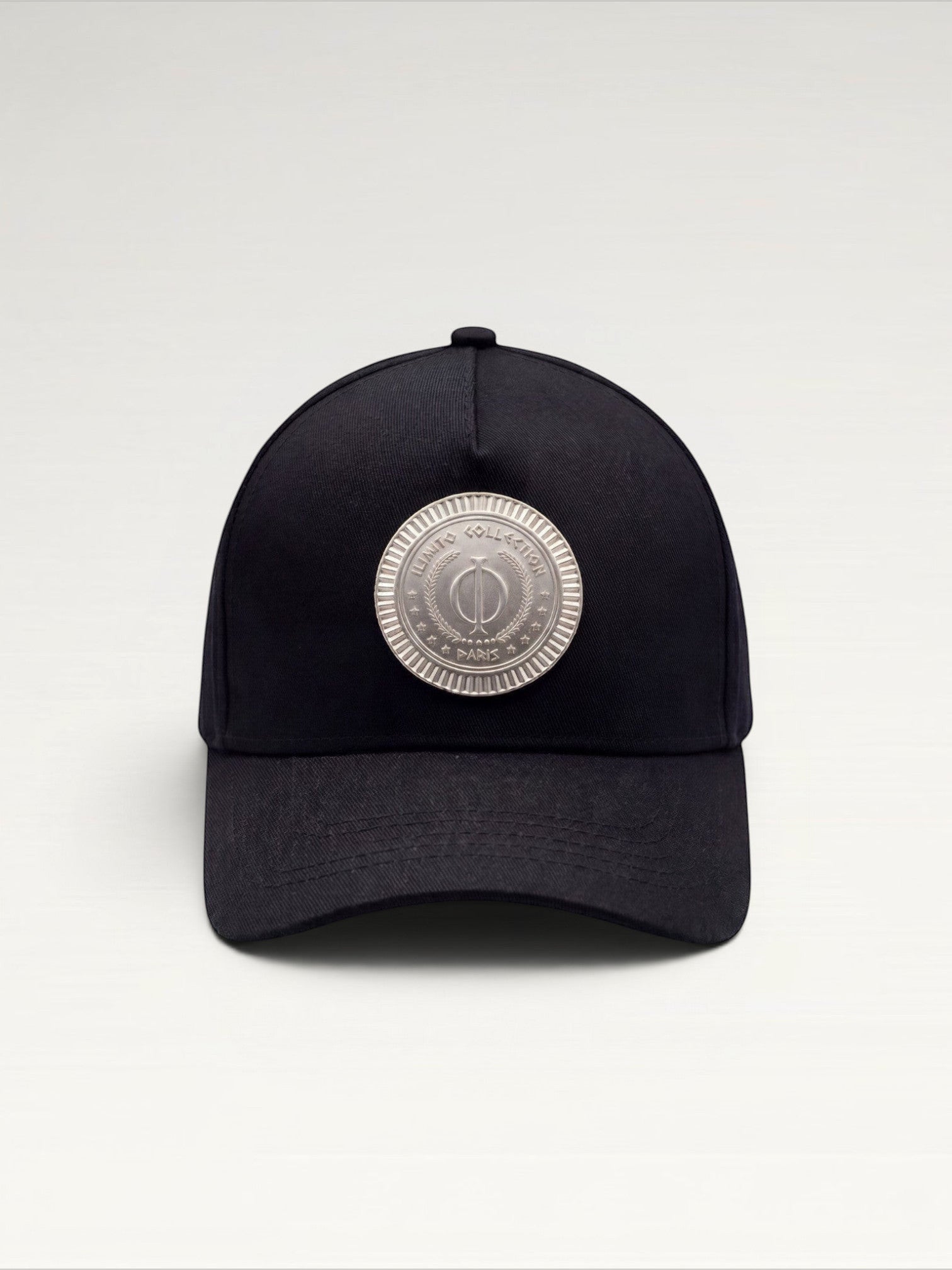 ILIMITO black cotton blend cap with silver medallion detail on the crown