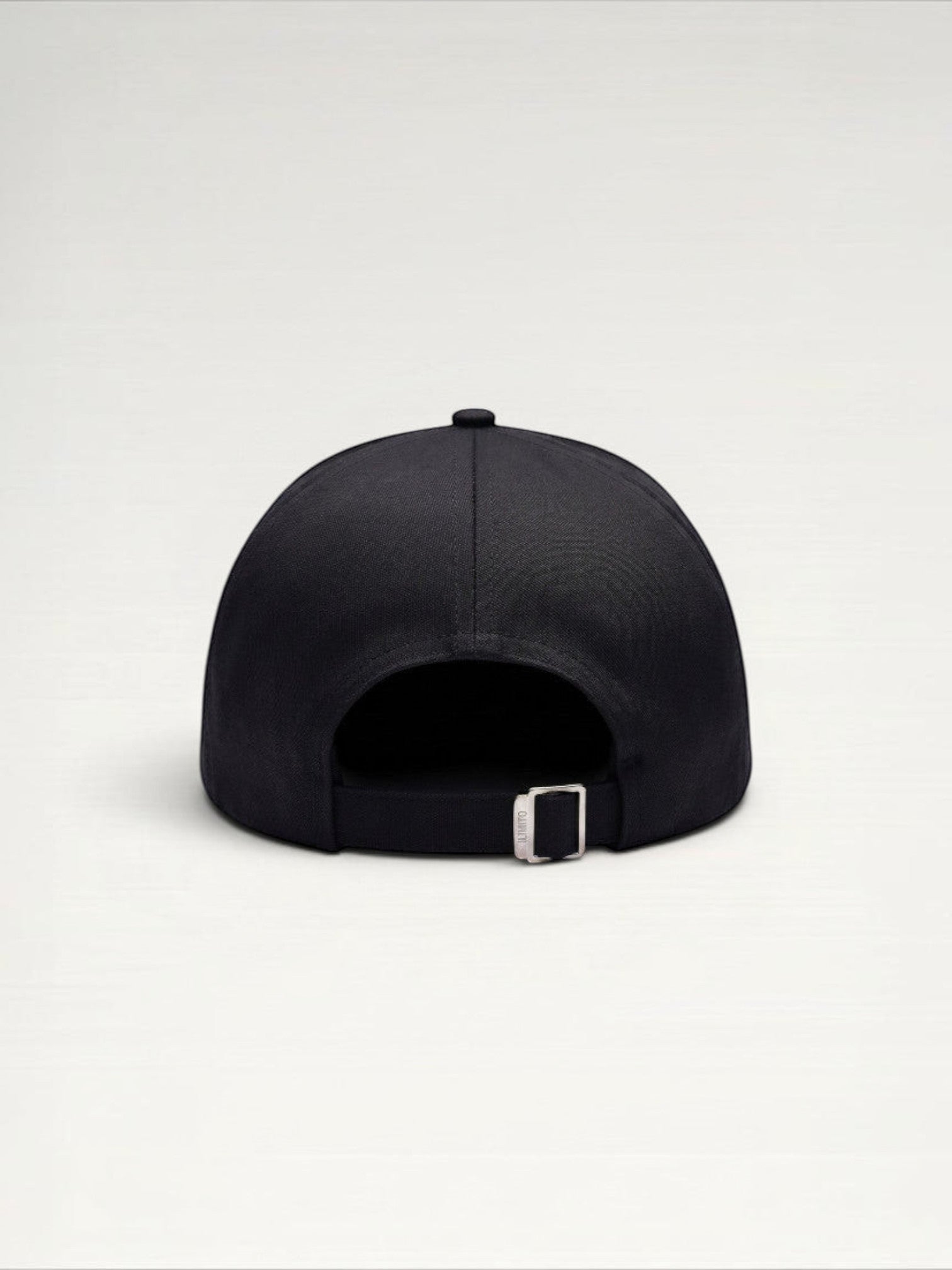 ILIMITO black cotton blend cap with curved brim, silver medallion detail on front, and silver medal accents on visor.
