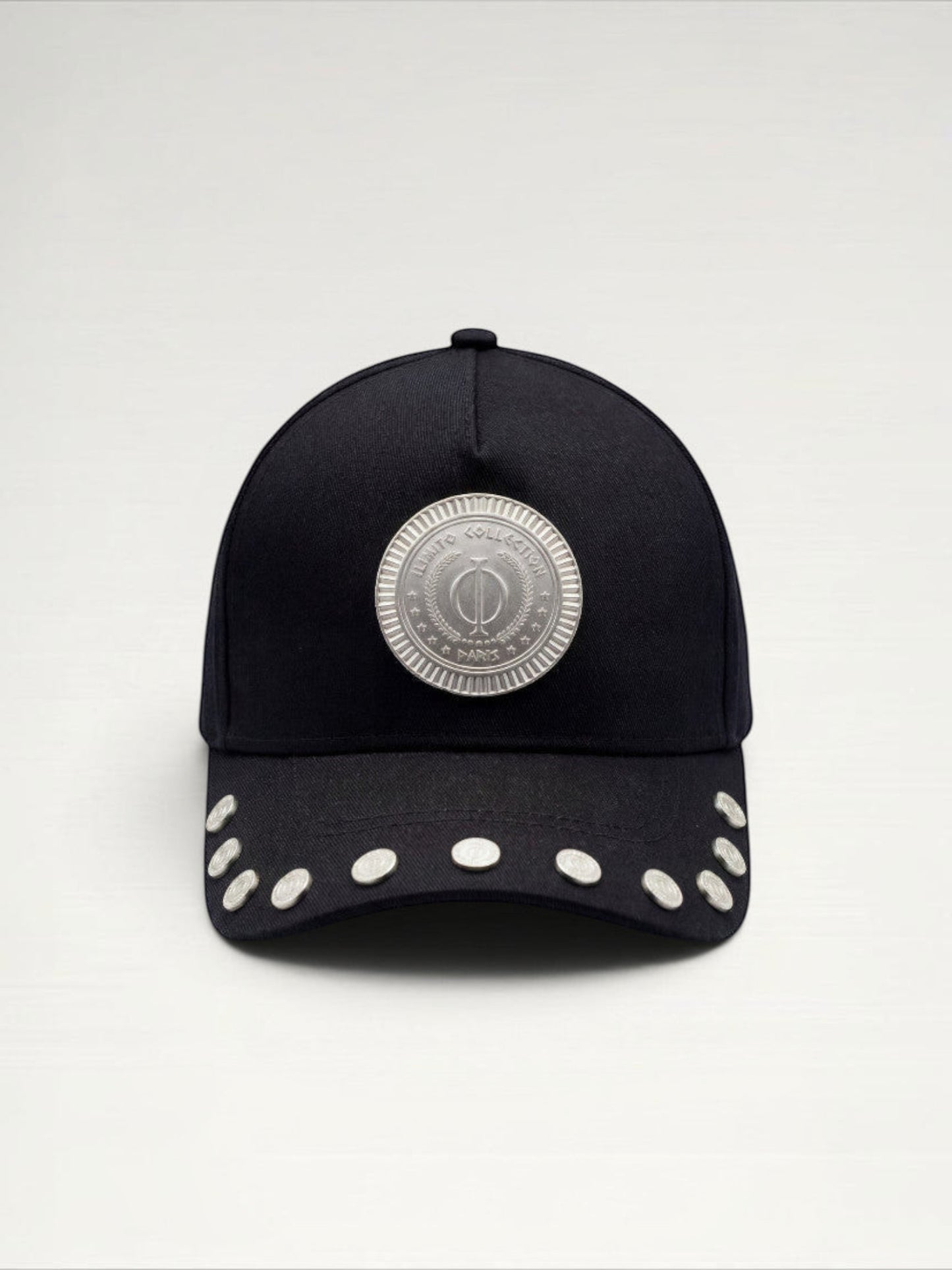 ILIMITO black cotton blend cap with curved brim, silver medallion detail on front, and silver medal accents on visor.
