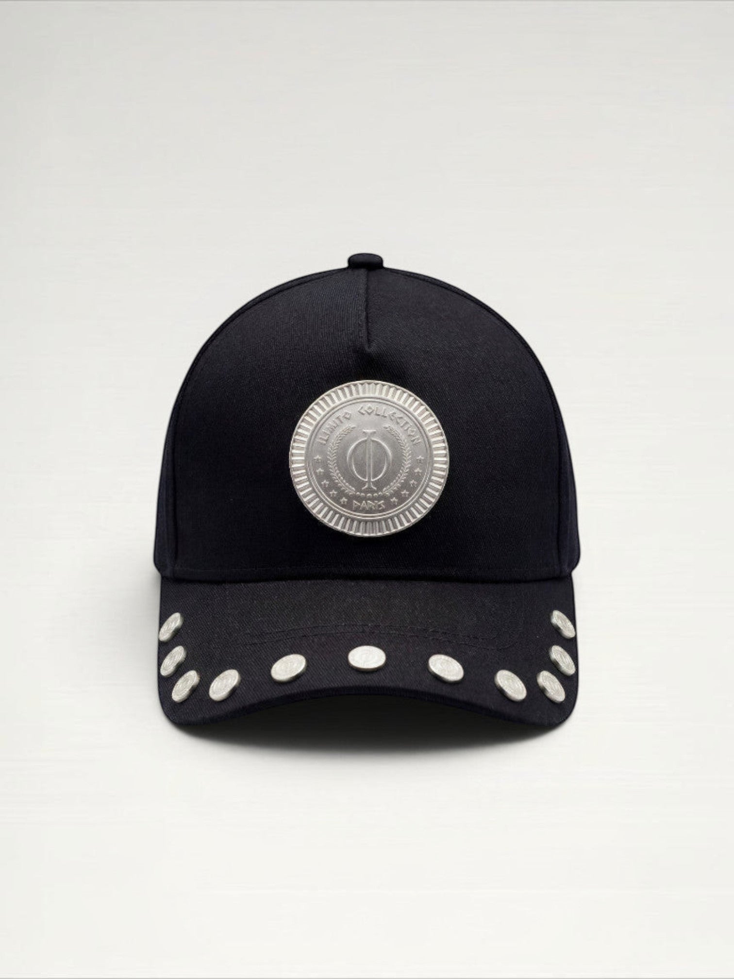 ILIMITO black cotton blend cap with curved brim, silver medallion detail on front, and silver medal accents on visor.