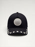 ILIMITO black cotton blend cap with curved brim, silver medallion detail on front, and silver medal accents on visor.