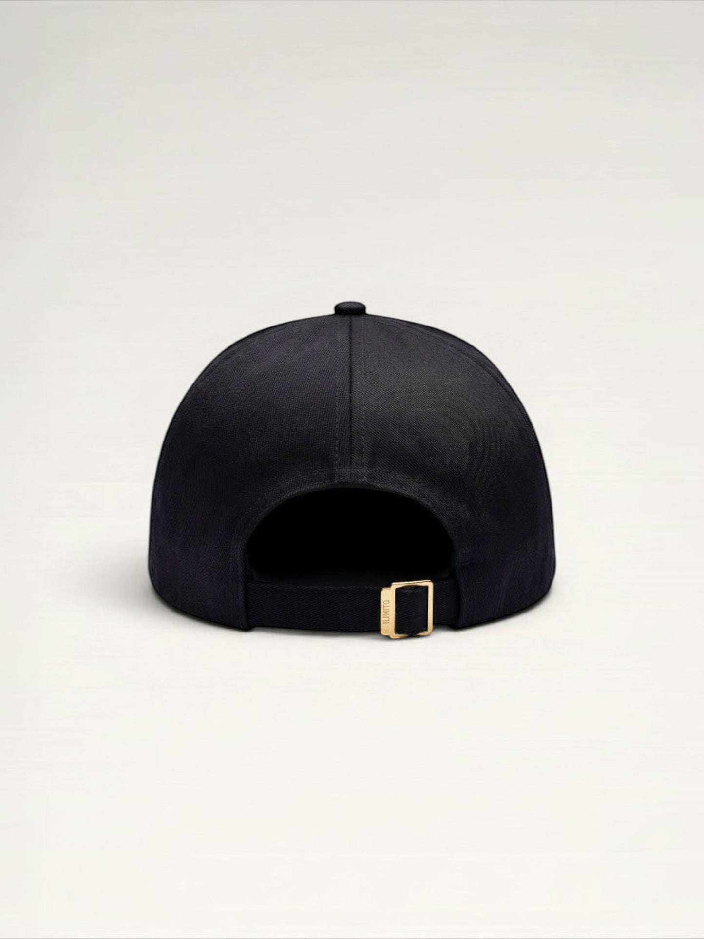 ILIMITO black cotton blend baseball cap with gold medallion emblem and gold medal accents on the visor.