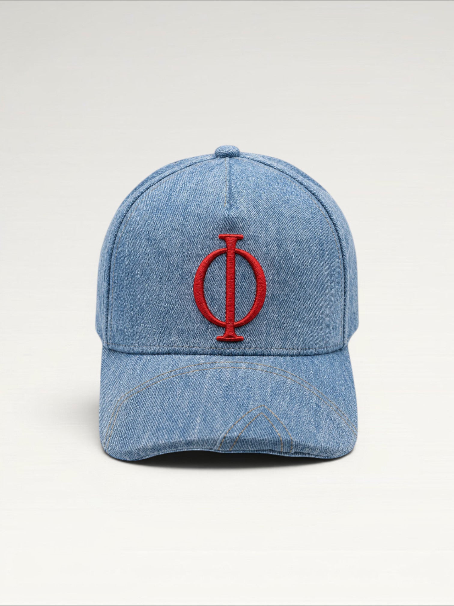 ILIMITO light wash denim baseball cap with red embroidered logo emblem, curved brim, adjustable strap. Unisex fit.