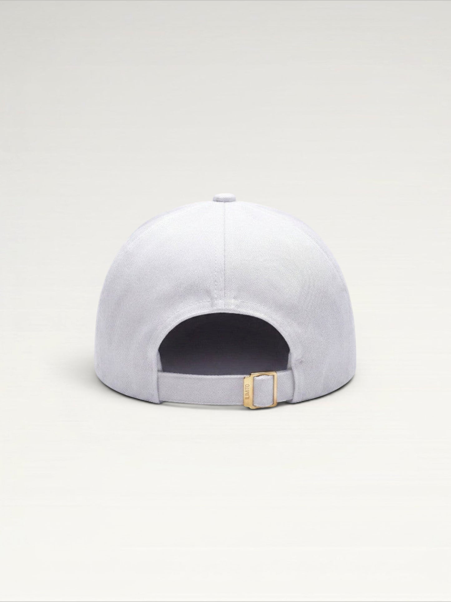 ILIMITO white cotton blend baseball cap with gold medallion detail and adjustable strap