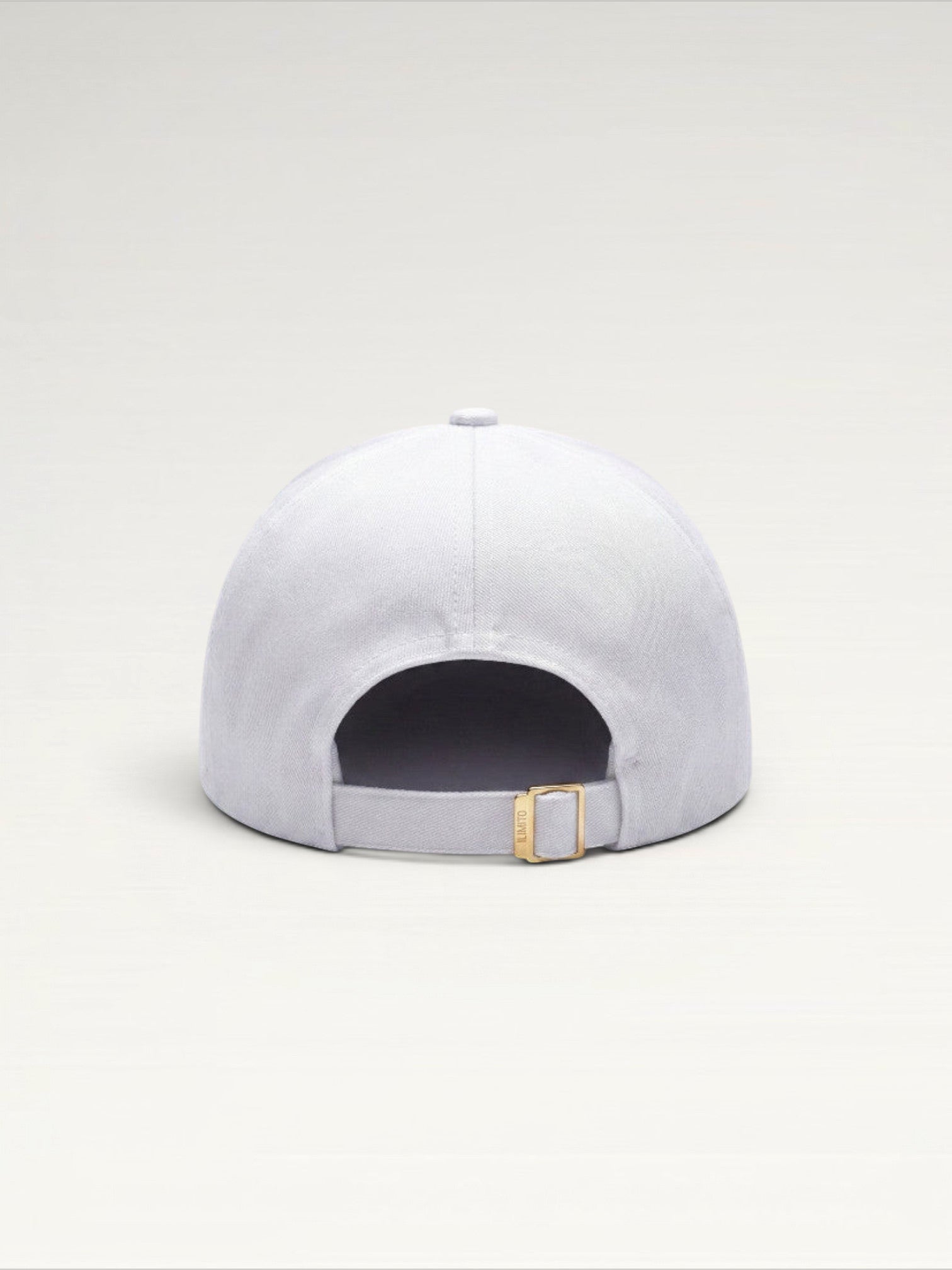 ILIMITO white cotton blend baseball cap with gold medallion detail and adjustable strap