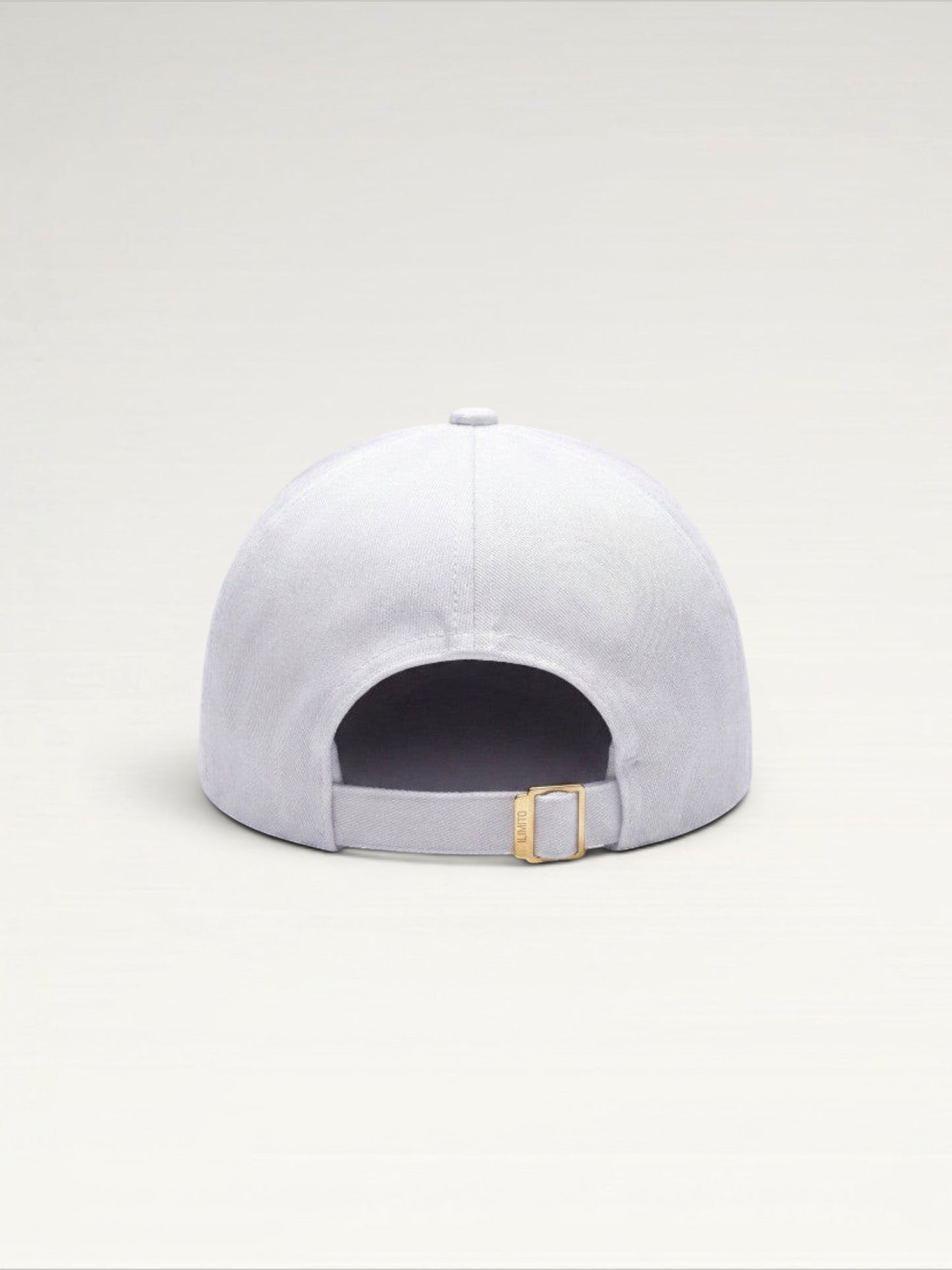 ILIMITO white cotton blend cap with gold medallion detail and accents on the visor. Unisex, adjustable fit