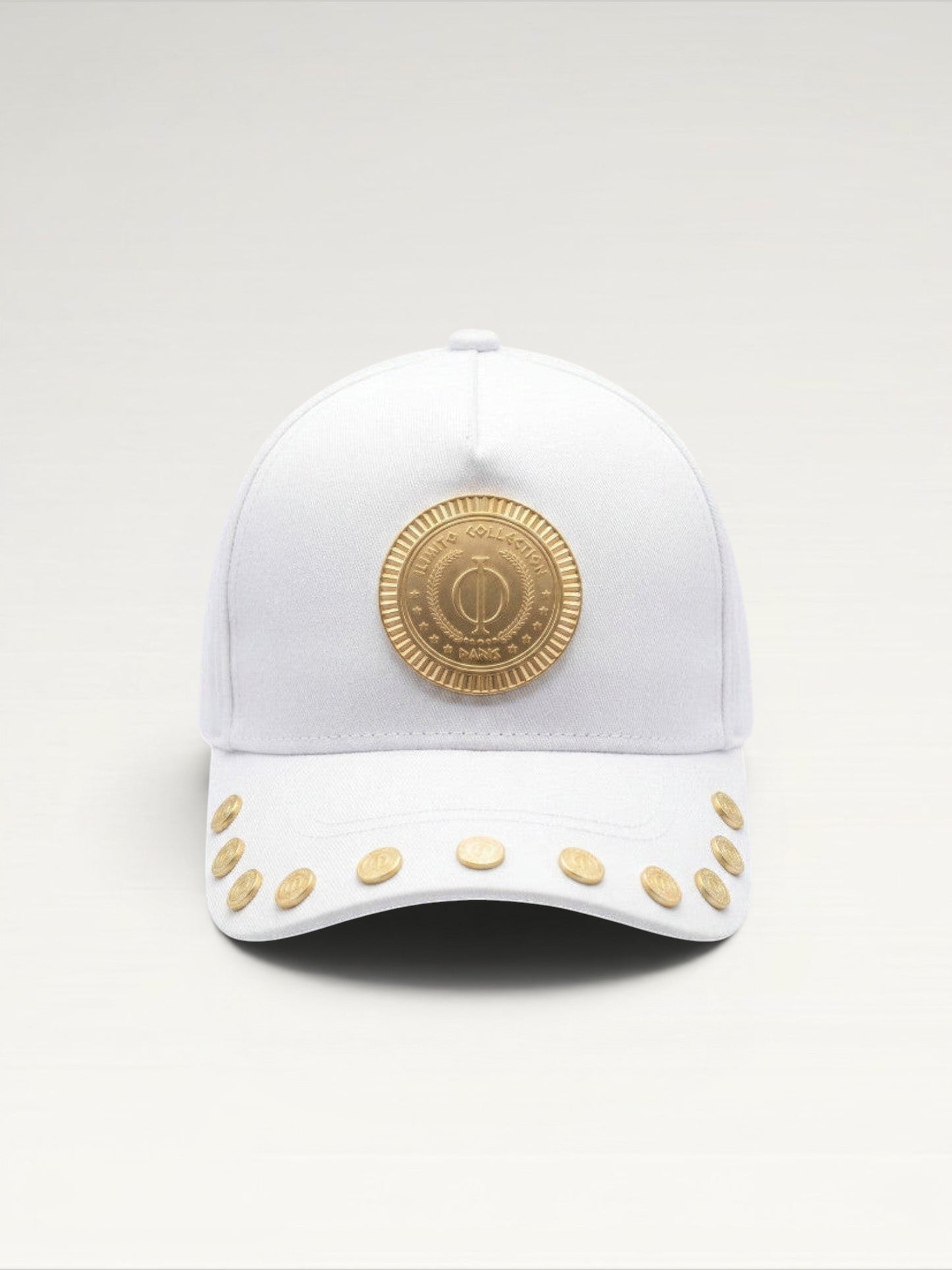 ILIMITO white cotton blend cap with gold medallion detail and accents on the visor. Unisex, adjustable fit