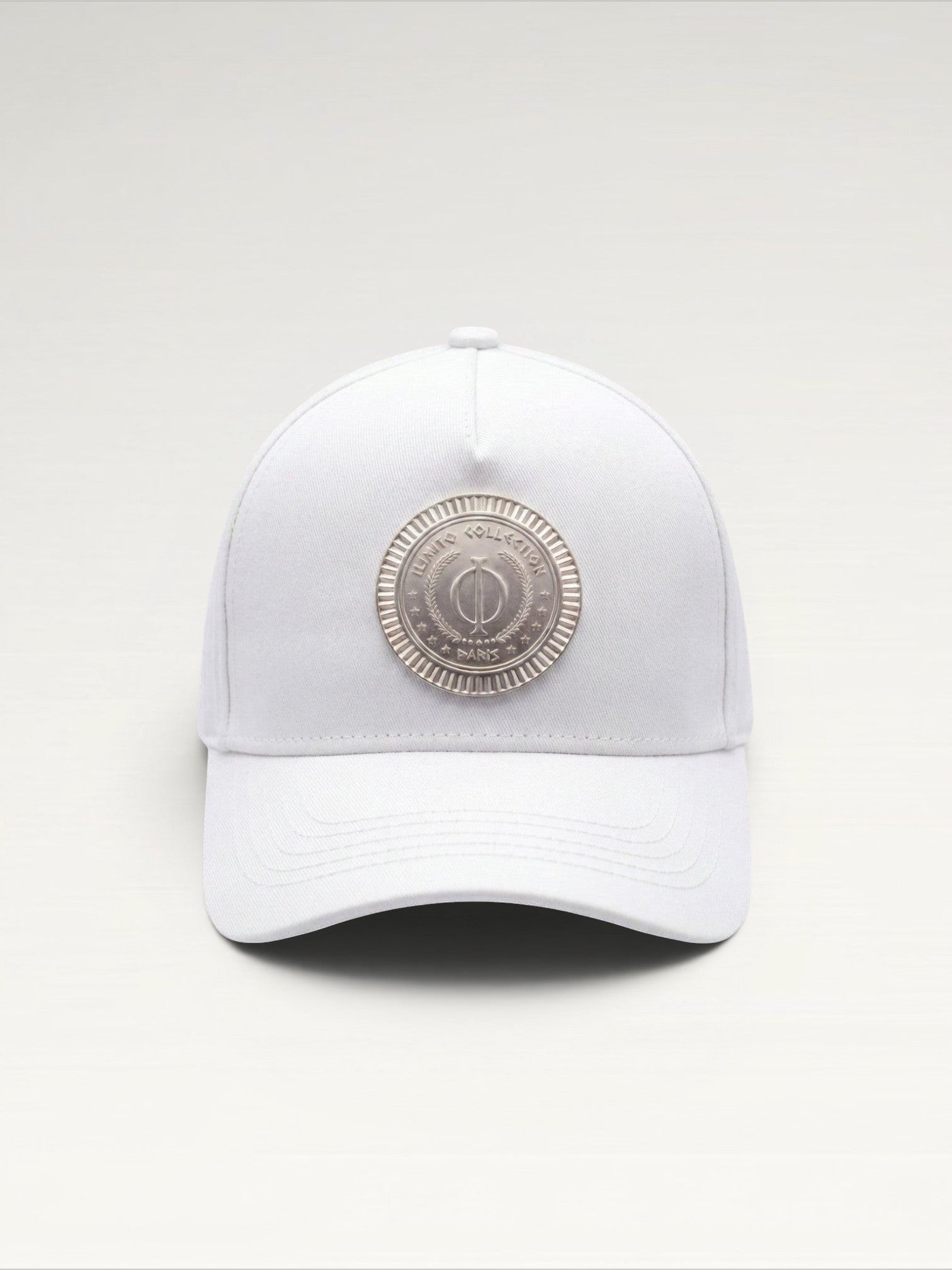ILIMITO white cotton blend cap with curved brim and silver medallion detail on the front.