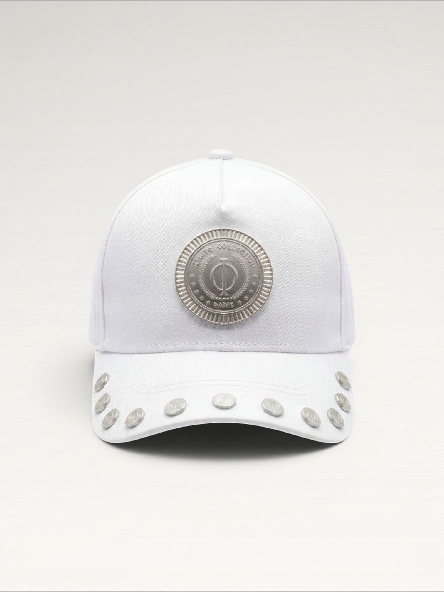 ILIMITO white cotton blend cap with silver medallion detail and accents on the visor. Unisex, adjustable fit.