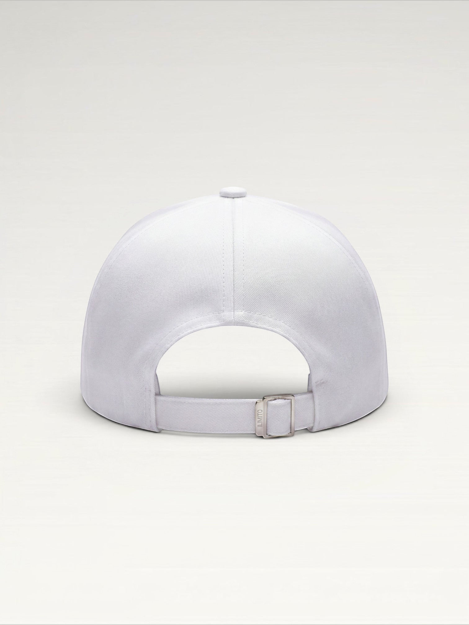 ILIMITO white cotton blend baseball cap with silver medallion detail and adjustable strap