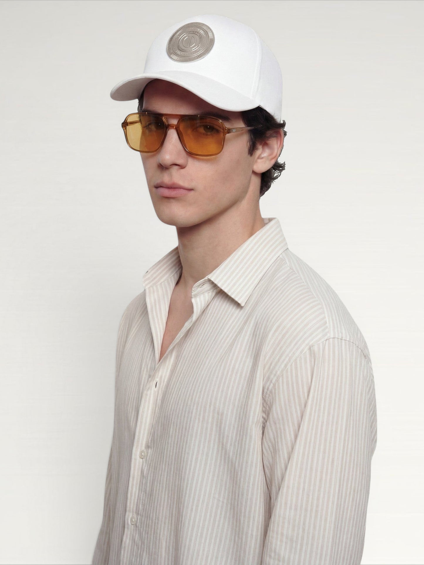 ILIMITO white cotton blend cap with curved brim and silver medallion detail on the front.